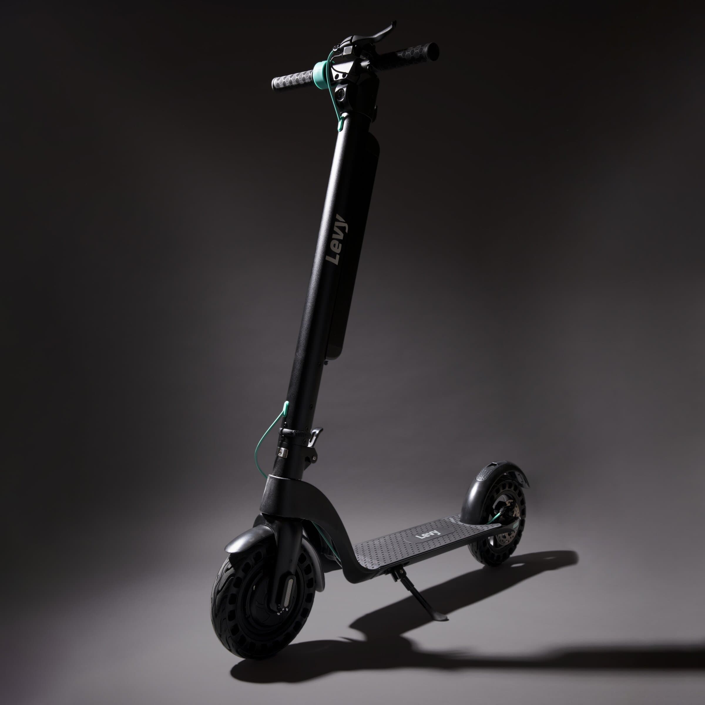 Levy electric scooter with mint details and a swappable battery